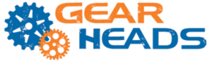 The word gear in orange and the word heads in blue with two blue and orange cogs next to the words